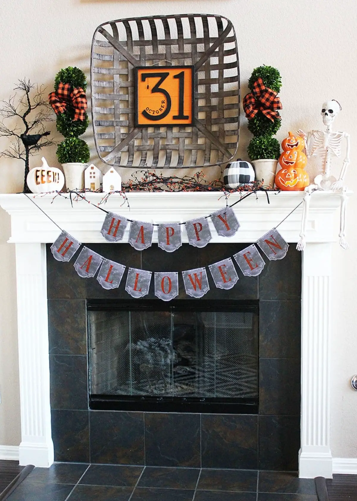 mantel with a big 31 and banner that says happy halloween