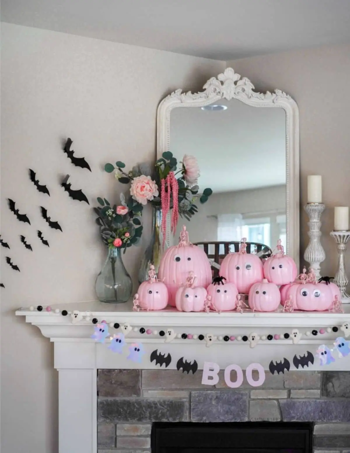 halloween mantel with pink pumpkins and Boo banner