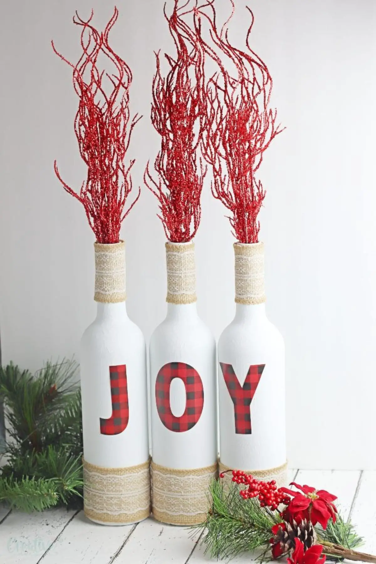 Christmas craft where you turn decorate wine bottles to say Joy