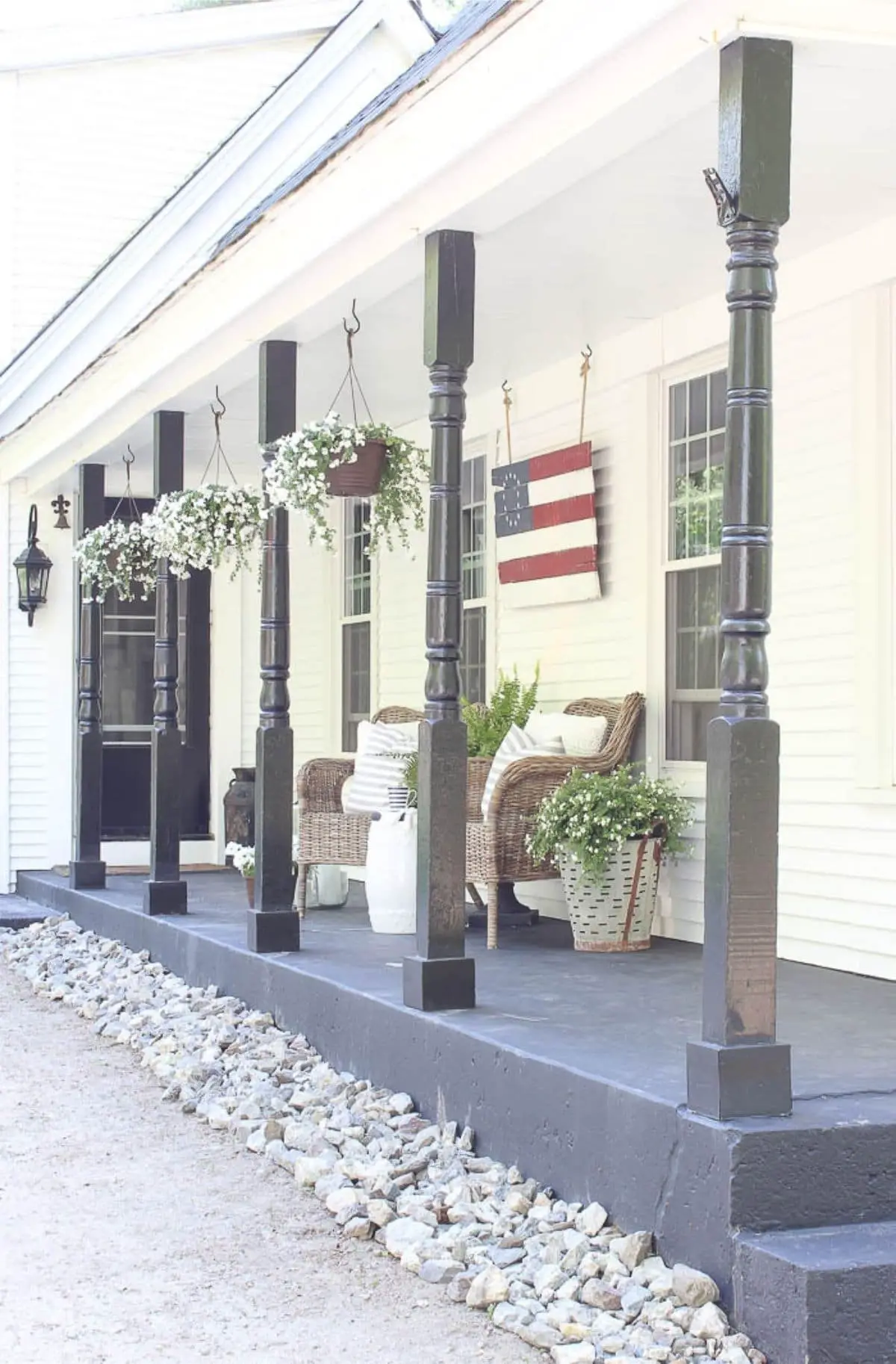porch with hanging wood american flag and porch chairs
