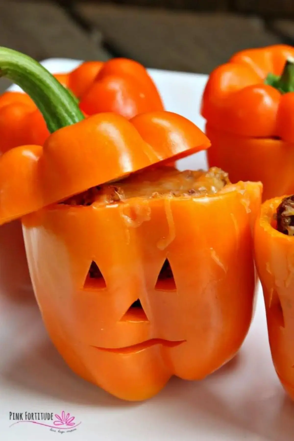 jack-o-lantern stuffed peppers